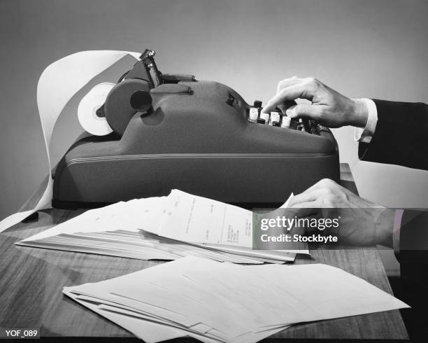 hands using adding machine - using stock pictures, royalty-free photos & images