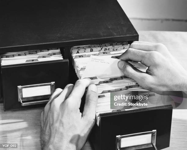 hand shot of man looking up address - of stock pictures, royalty-free photos & images