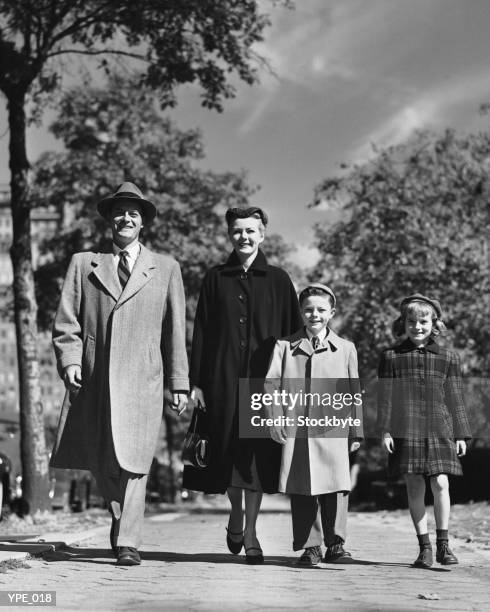 family walking along street - 1950s father stock pictures, royalty-free photos & images