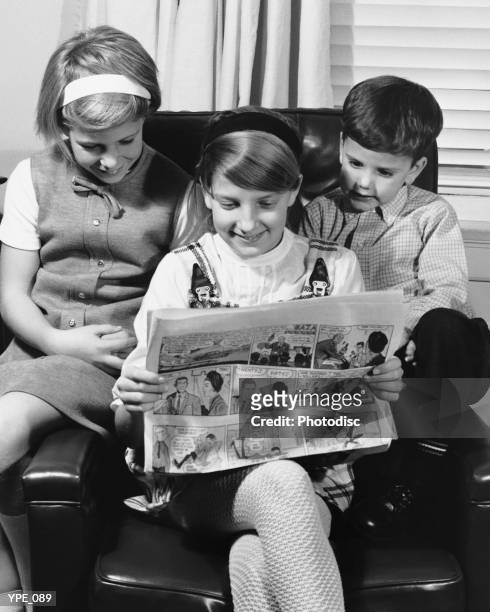 two girls and boy looking at paper - his and hers stock pictures, royalty-free photos & images