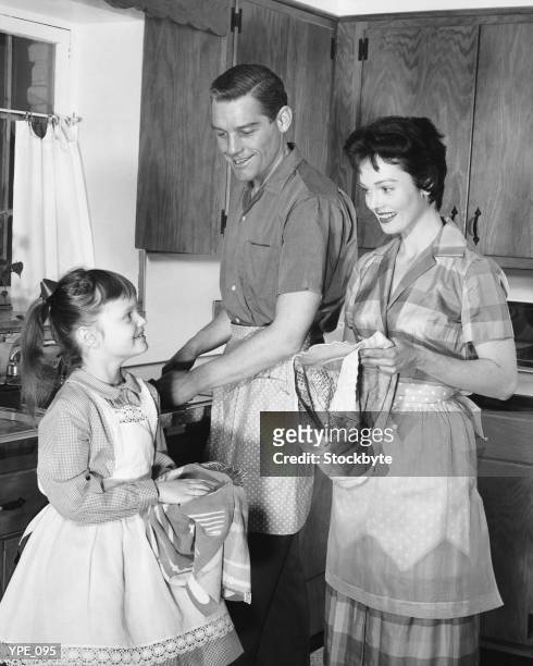 family doing dishes - duing stock pictures, royalty-free photos & images