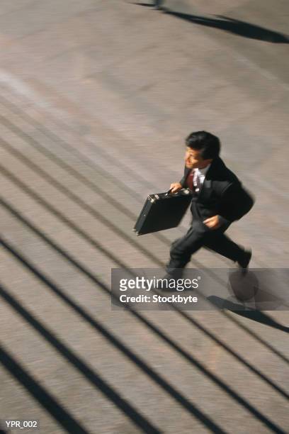 man running up stairs - only mid adult men stock pictures, royalty-free photos & images