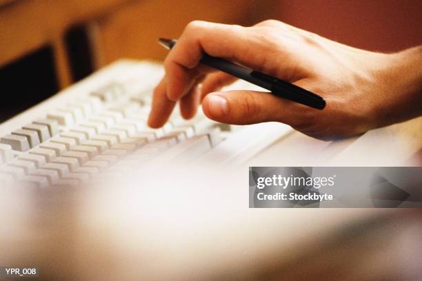 man's hand typing on keyboard, close-up - up stock pictures, royalty-free photos & images