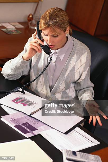 woman talking on phone in office - in stock pictures, royalty-free photos & images