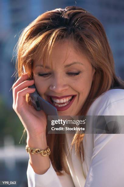 woman talking on cellular phone - media gather outside of the home of business secretary vince cable after his comments on bskyb emerged stockfoto's en -beelden