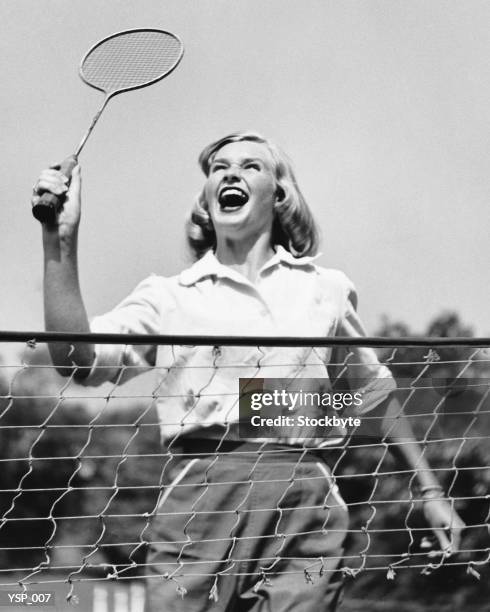 woman playing badminton - birdie stock pictures, royalty-free photos & images