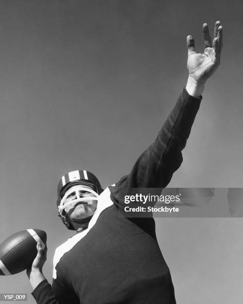 man preparing to throw football - next to stock pictures, royalty-free photos & images