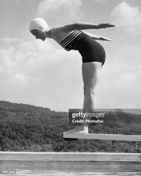 woman preparing to dive into pool - next to stock pictures, royalty-free photos & images