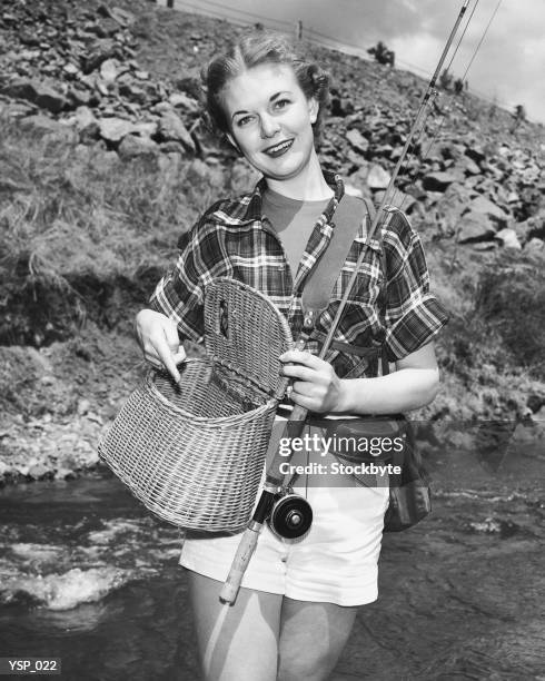 woman holding creel and fishing rod - his and hers stock pictures, royalty-free photos & images