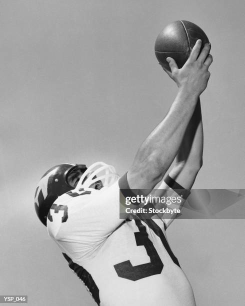 man catching football - black and white football images stock pictures, royalty-free photos & images