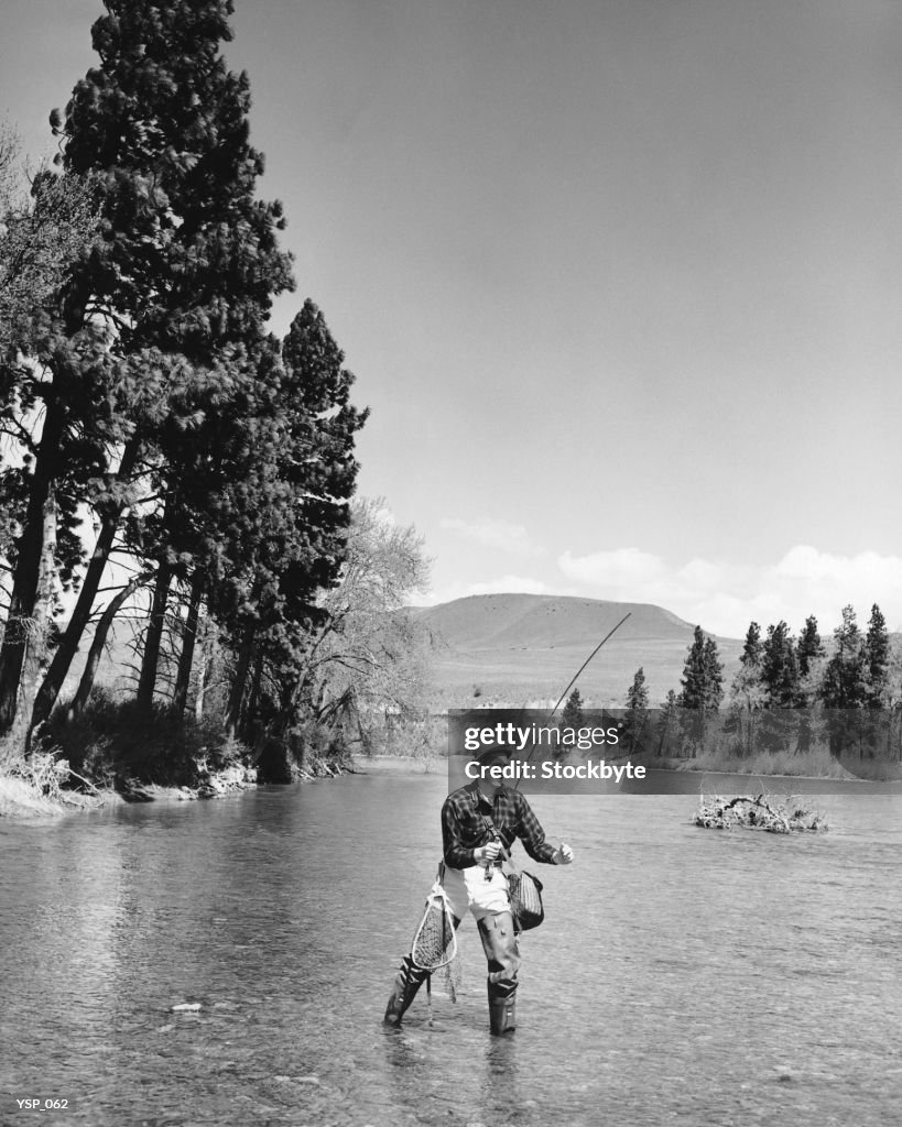 Man fly-fishing in stream