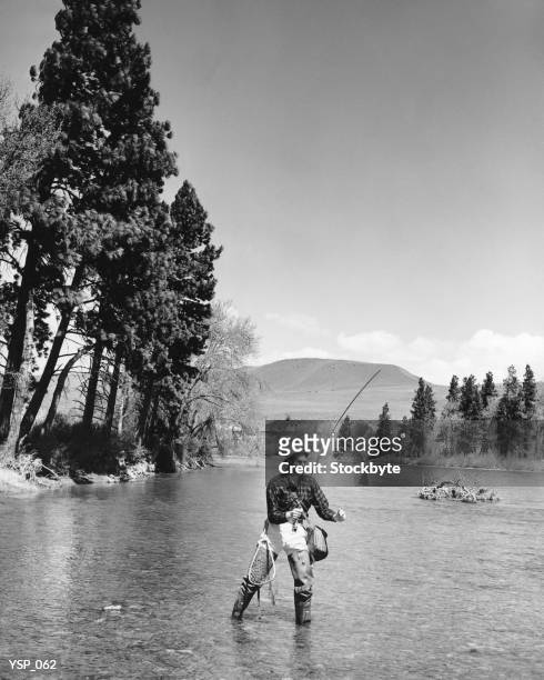 man fly-fishing in stream - in stock pictures, royalty-free photos & images