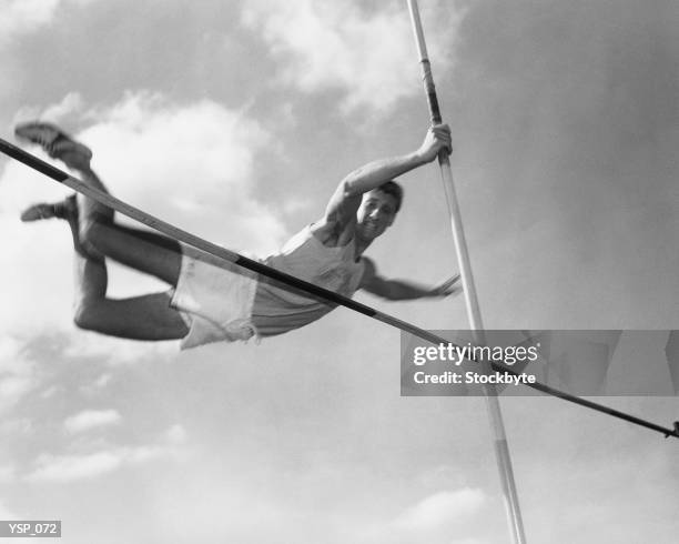 male pole-vaulter clearing bar - no perfection stock pictures, royalty-free photos & images