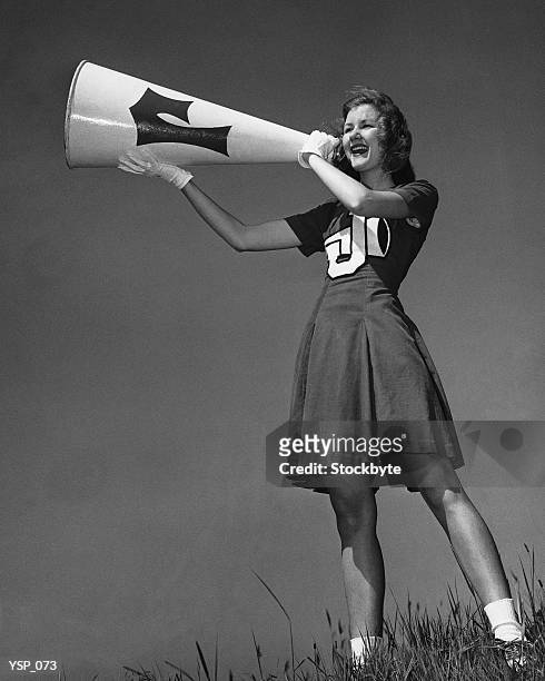 female cheerleader using megaphone - nicht städtisches motiv stock-fotos und bilder