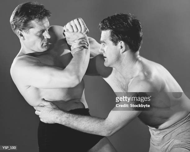two men wrestling - only mid adult men stock pictures, royalty-free photos & images