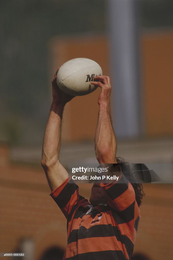 Man Playing Rugby