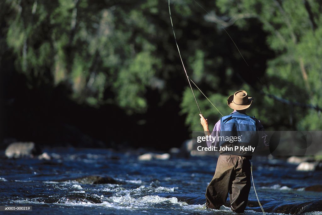 Man Fly Fishing in River