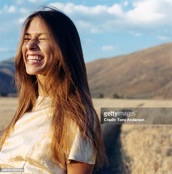 woman grinning with eyes shut - glattes haar stock-fotos und bilder