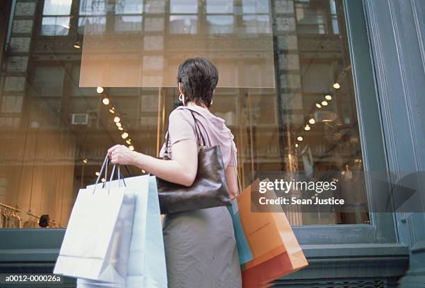 woman window shopping - shopping bag stock pictures, royalty-free photos & images