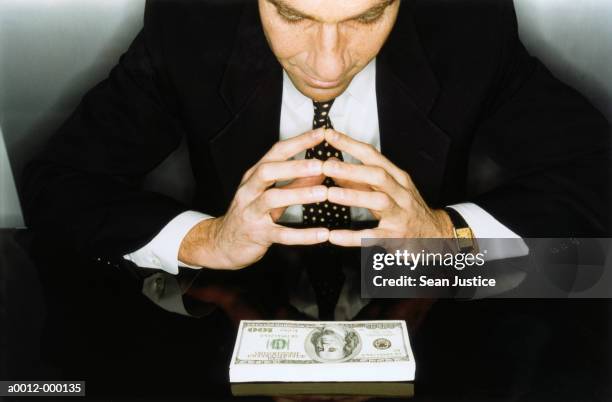 businessman with paper notes - greed stock pictures, royalty-free photos & images