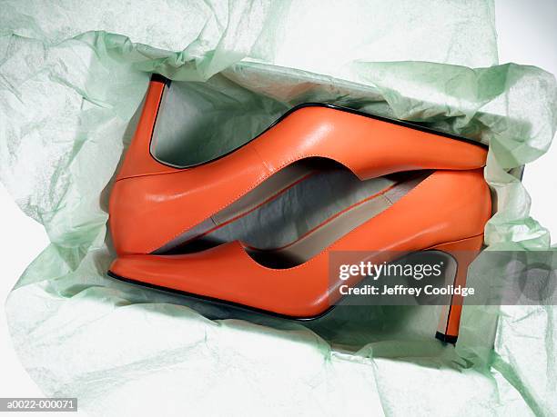 new high heeled shoes in box - orange shoe stock-fotos und bilder