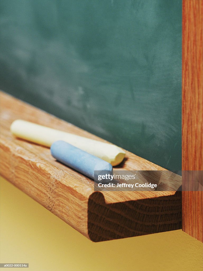 Chalk On Blackboard Ledge High-Res Stock Photo - Getty Images