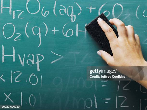 hand erasing equations - eraser stock pictures, royalty-free photos & images