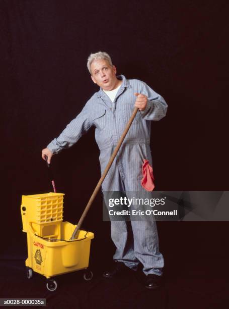 janitor with mop and bucket - conserje fotografías e imágenes de stock