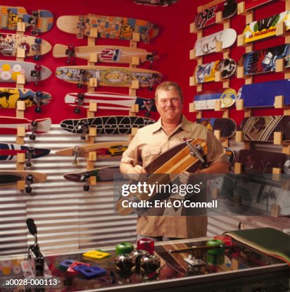 Man in Skateboard Store Man in Skateboard Store