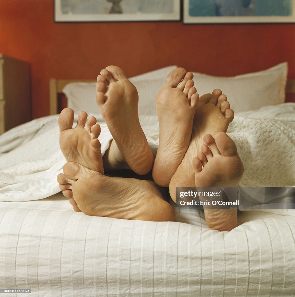 Bare Feet in Bed