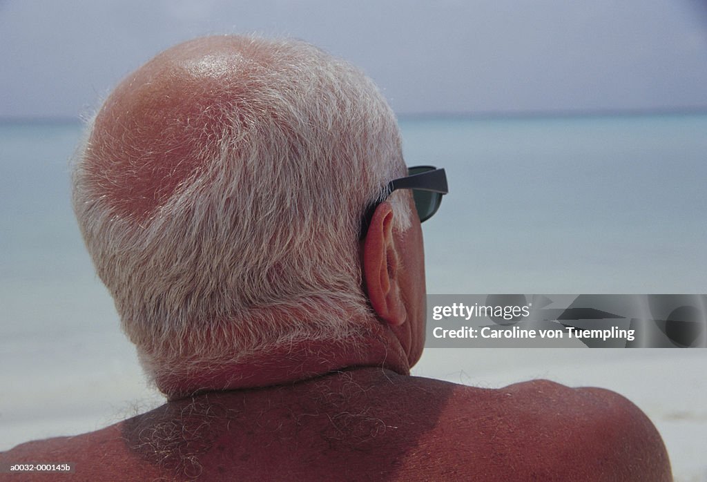 Elderly Man Looking out to Sea