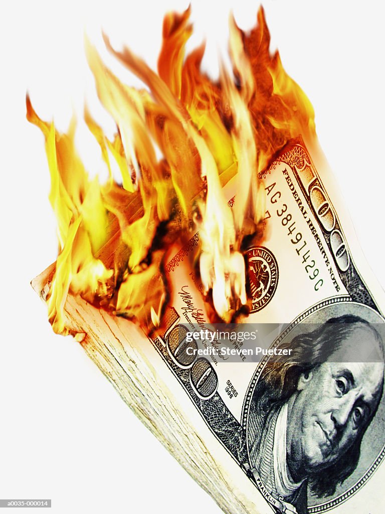 100 Dollar Notes in Flames