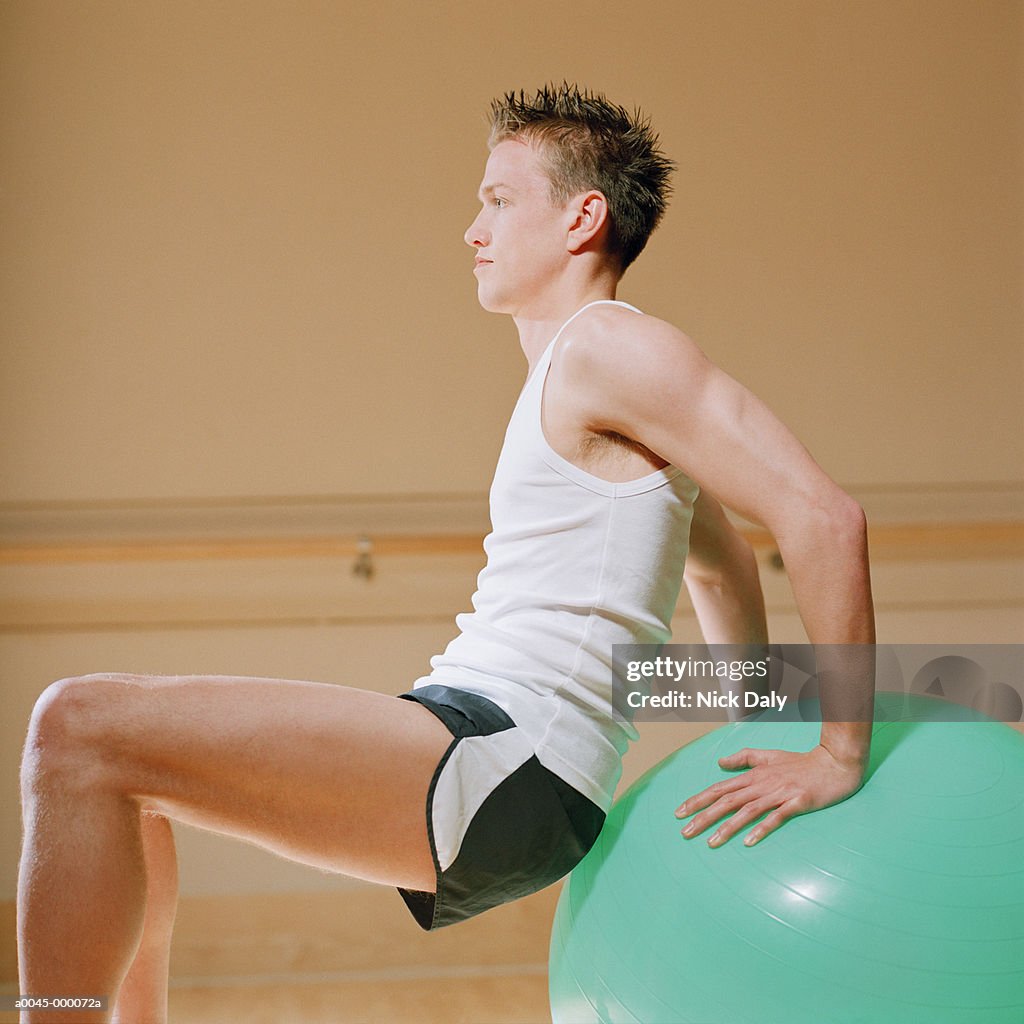 Man Balancing on Fitness Ball