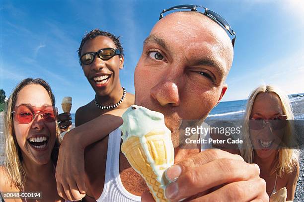 group eating ice cream - fischaugen objektiv stock-fotos und bilder