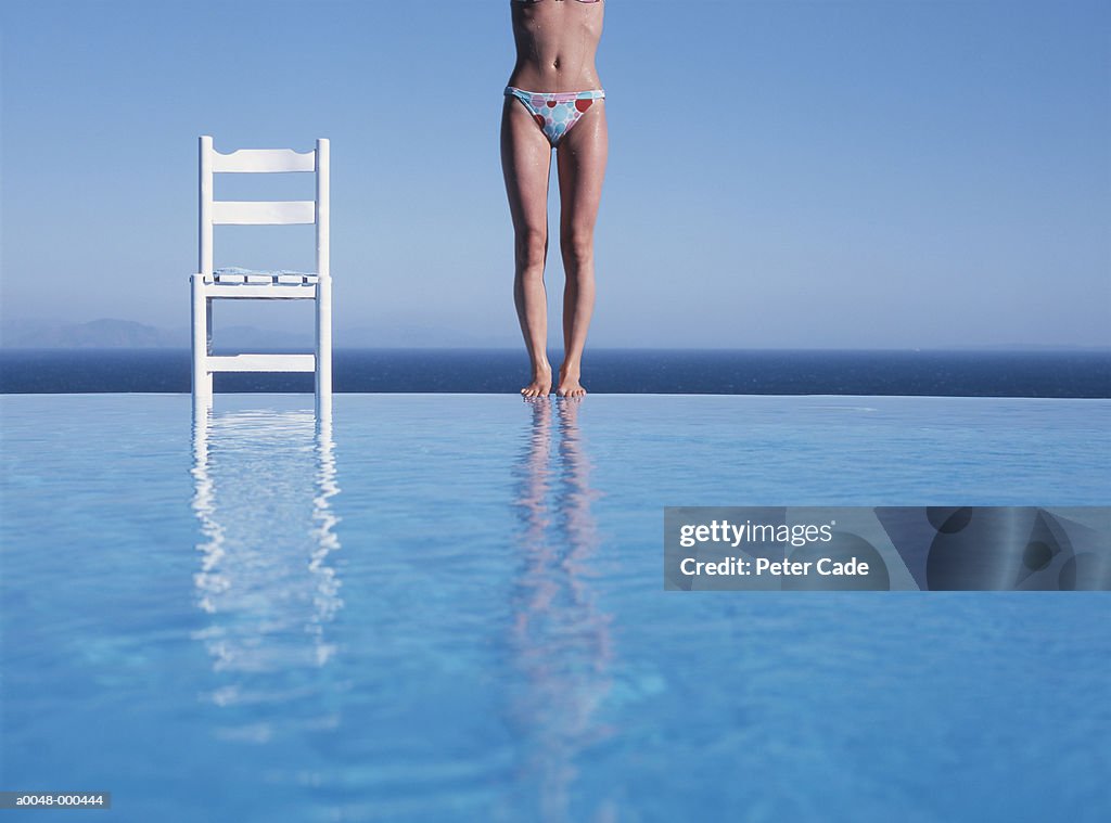 Woman Standing on Edge of Pool