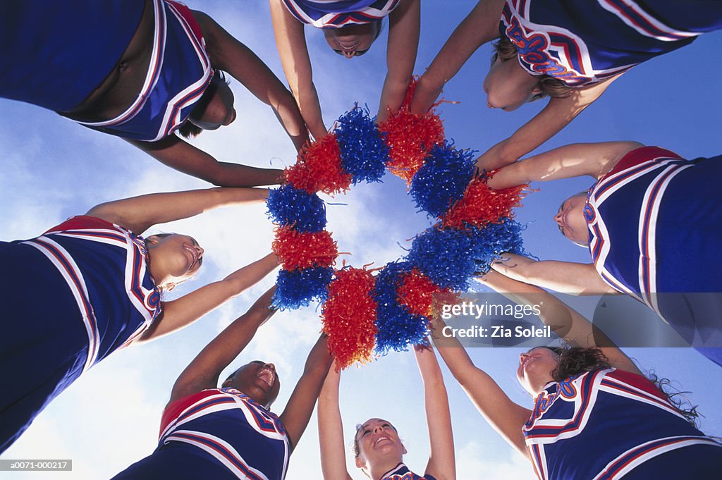 Cheerleaders Holding Pom-Poms