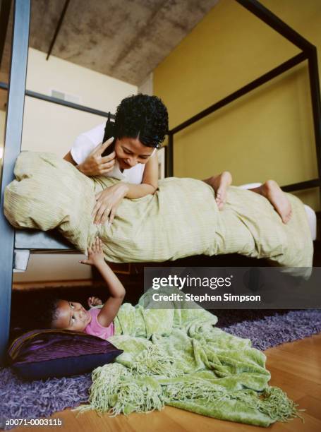 mother and daughter playing - fun simpson stock pictures, royalty-free photos & images