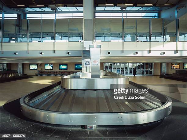 baggage claim - airport terminal interior stock-fotos und bilder