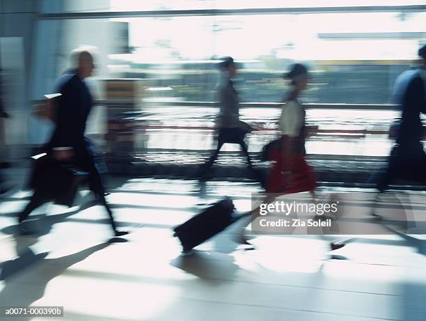 people in airport - valise soleil stock pictures, royalty-free photos & images