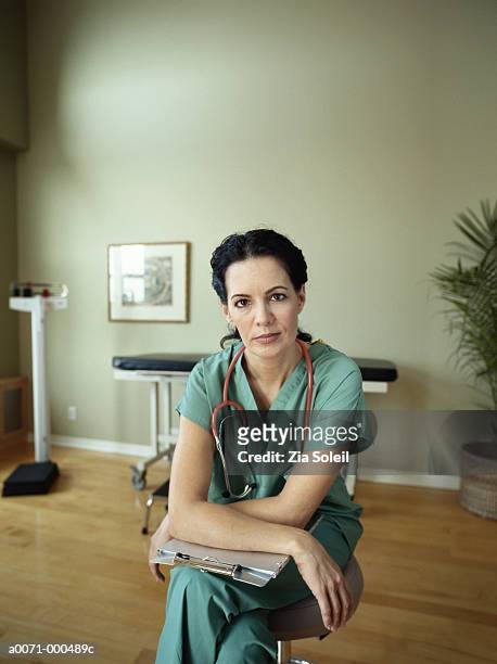 portrait of nurse - three quarter length stock pictures, royalty-free photos & images