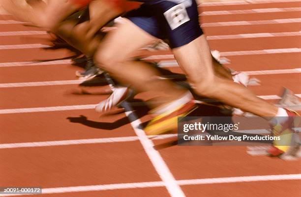 sprinters in motion - track starting block stock pictures, royalty-free photos & images