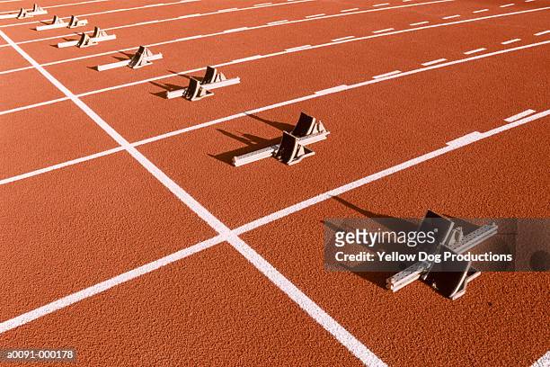 starting blocks on track - athletics track stock-fotos und bilder