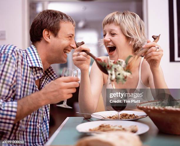 couple eating a meal - the joys of eating spaghetti stock pictures, royalty-free photos & images