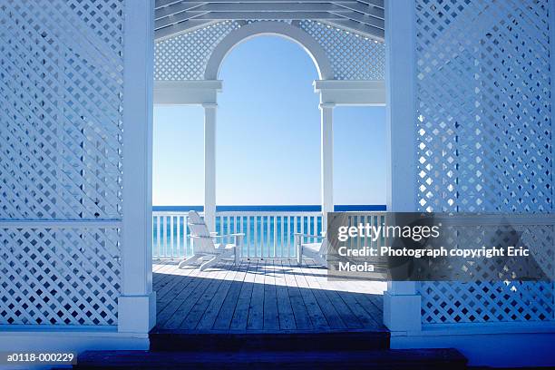 chairs on deck - white trellis stock pictures, royalty-free photos & images