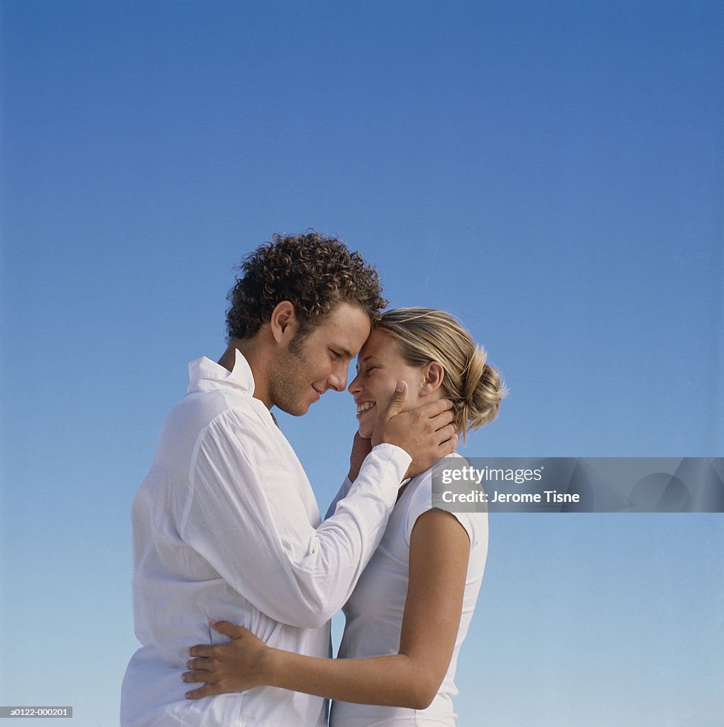 Couple Against Blue Sky