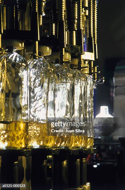 bottles in corn oil factory - olio di mais foto e immagini stock