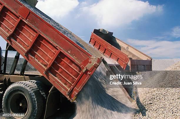 trucks unloading gravel - gravel stock pictures, royalty-free photos & images