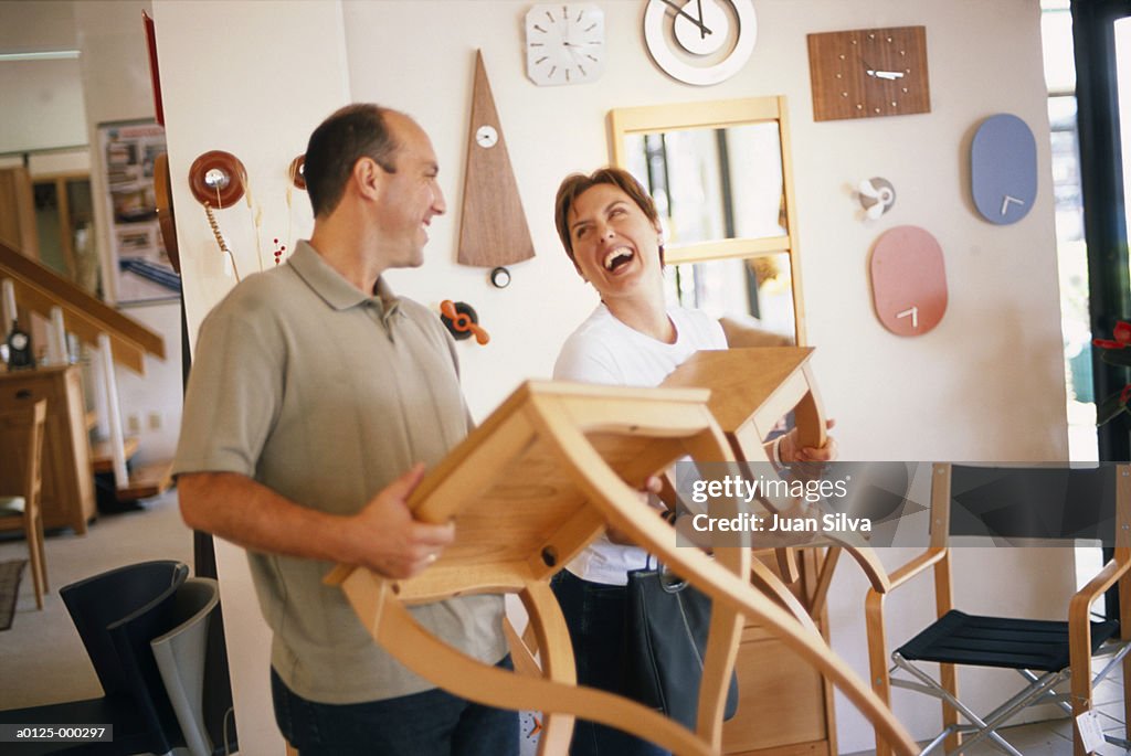 Couple Carrying Tables