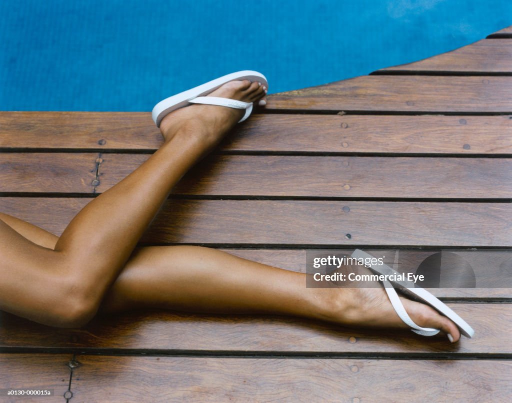 Woman's Legs on Pool Deck