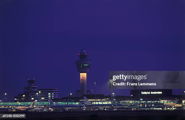 schiphol airport at night - amsterdam airport stock pictures, royalty-free photos & images